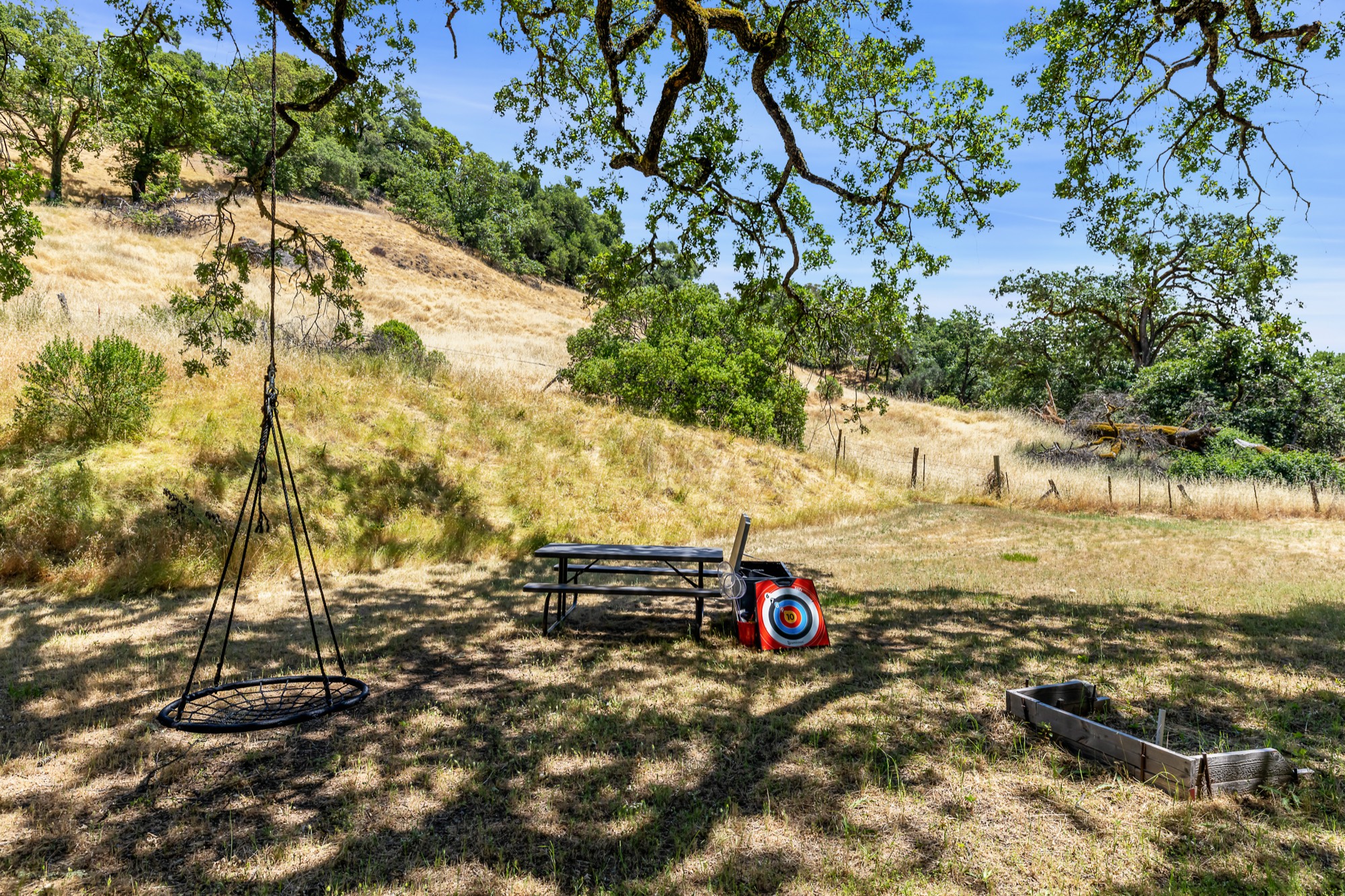 Rolling golden hills with oak trees