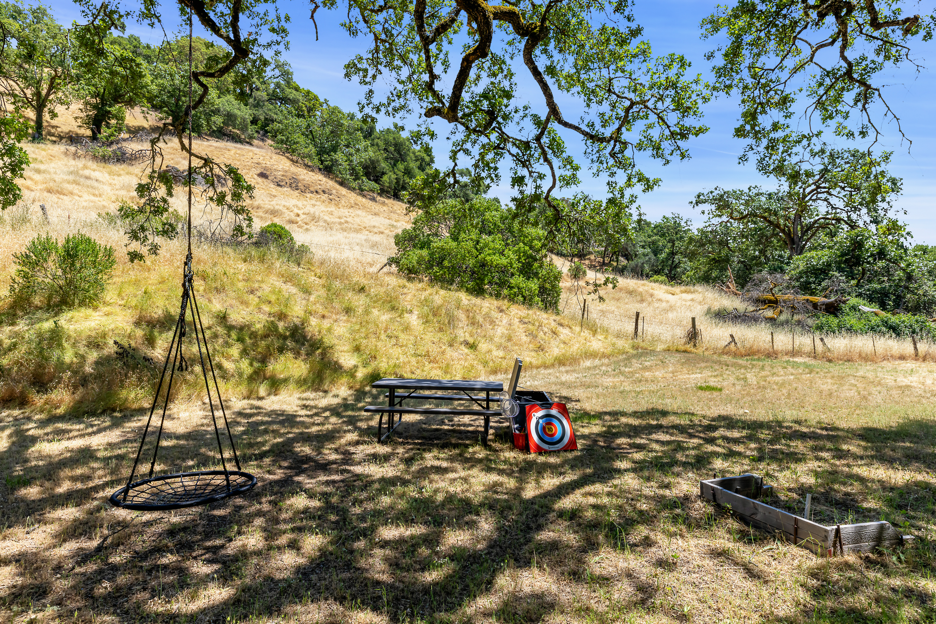 Rolling golden hills with oak trees